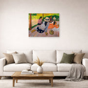 Unframed poster print of Paul Gauguin's The Siesta displayed on a wall in a second living room setting