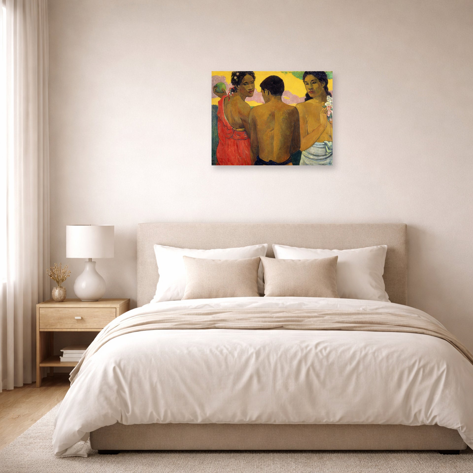 Unframed poster print of Paul Gauguin's Three Tahitians displayed on a wall in a bedroom