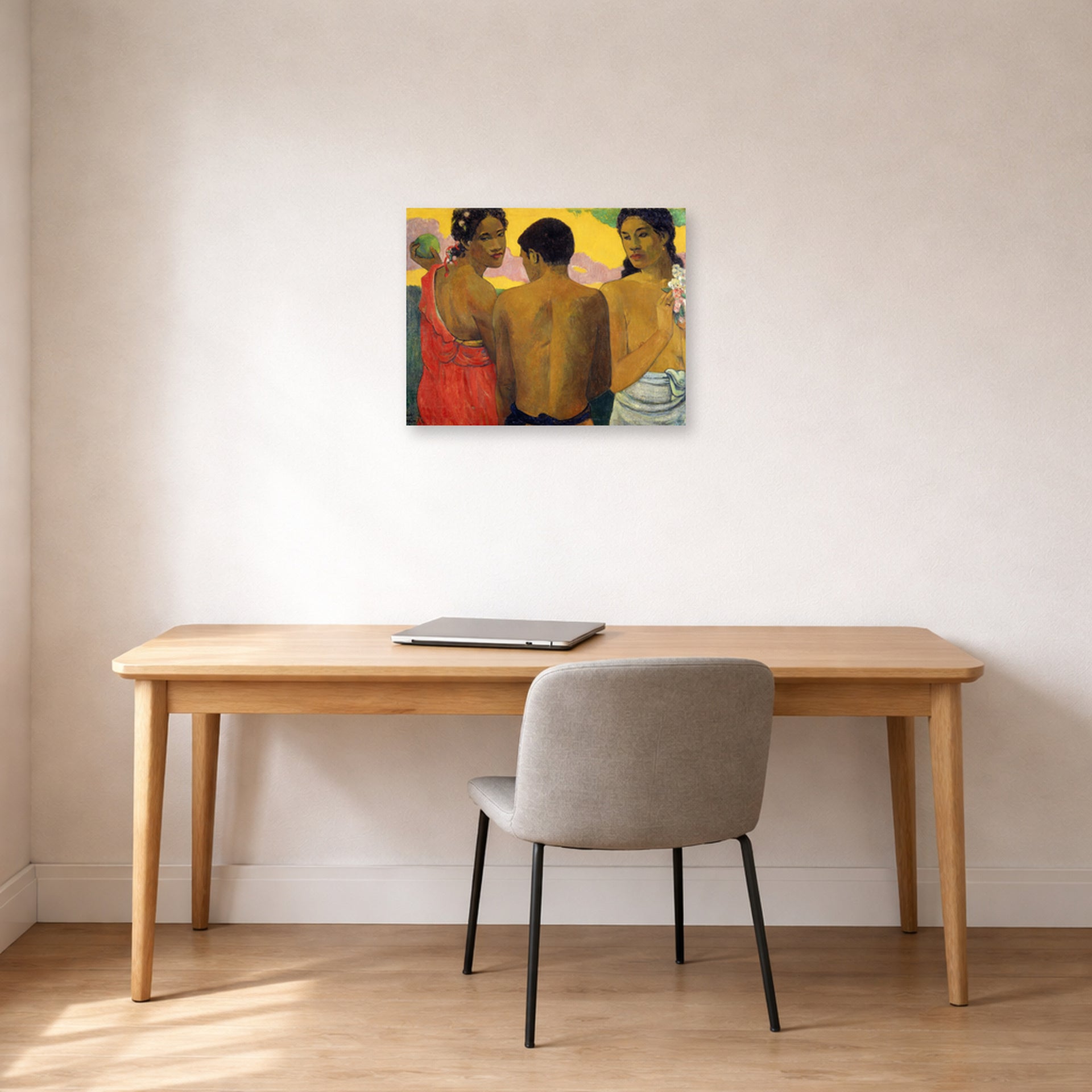 Unframed poster print of Paul Gauguin's Three Tahitians displayed on a wall in an office
