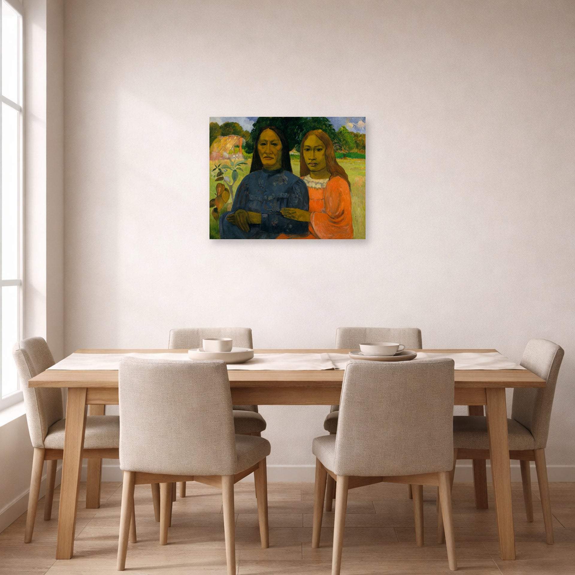 Unframed poster print of Paul Gauguin's Two Women displayed on a wall in a dining room
