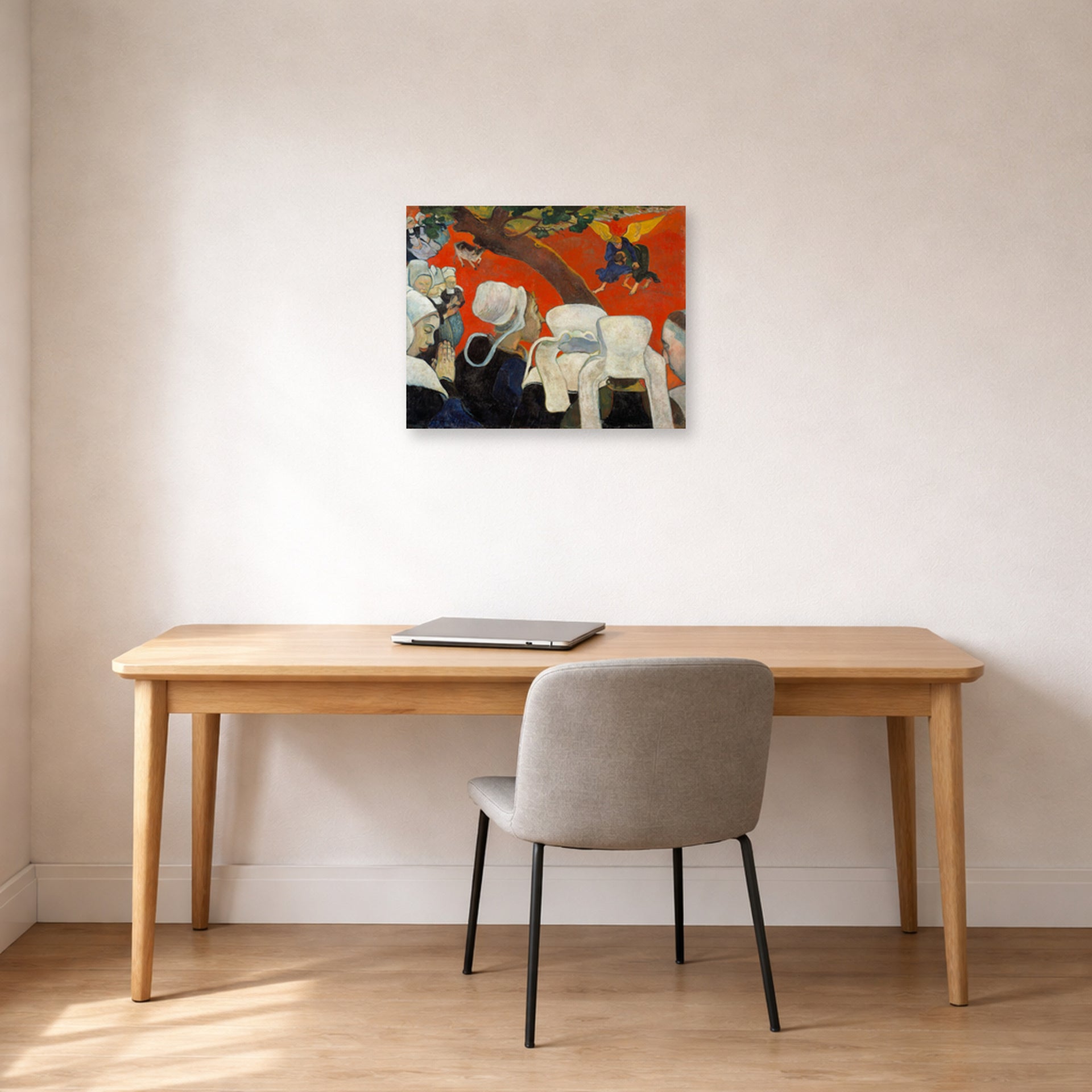 Unframed poster print of Paul Gauguin's Vision After the Sermon displayed on a wall in an office
