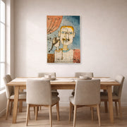 Unframed poster print of Paul Klee's Adam and Little Eve displayed on a wall in a dining room
