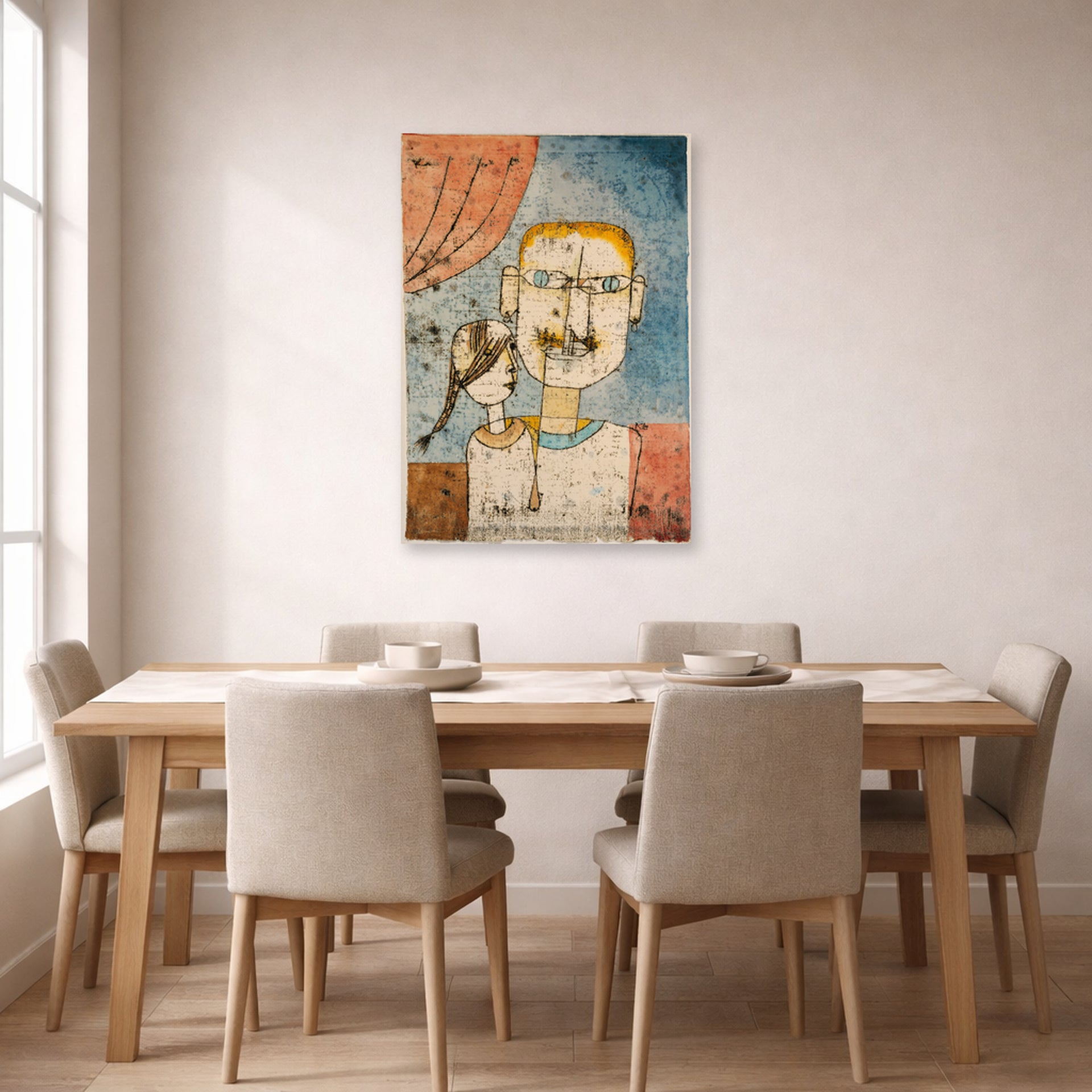 Unframed poster print of Paul Klee's Adam and Little Eve displayed on a wall in a dining room