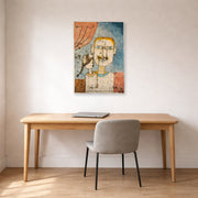 Unframed poster print of Paul Klee's Adam and Little Eve displayed on a wall in an office