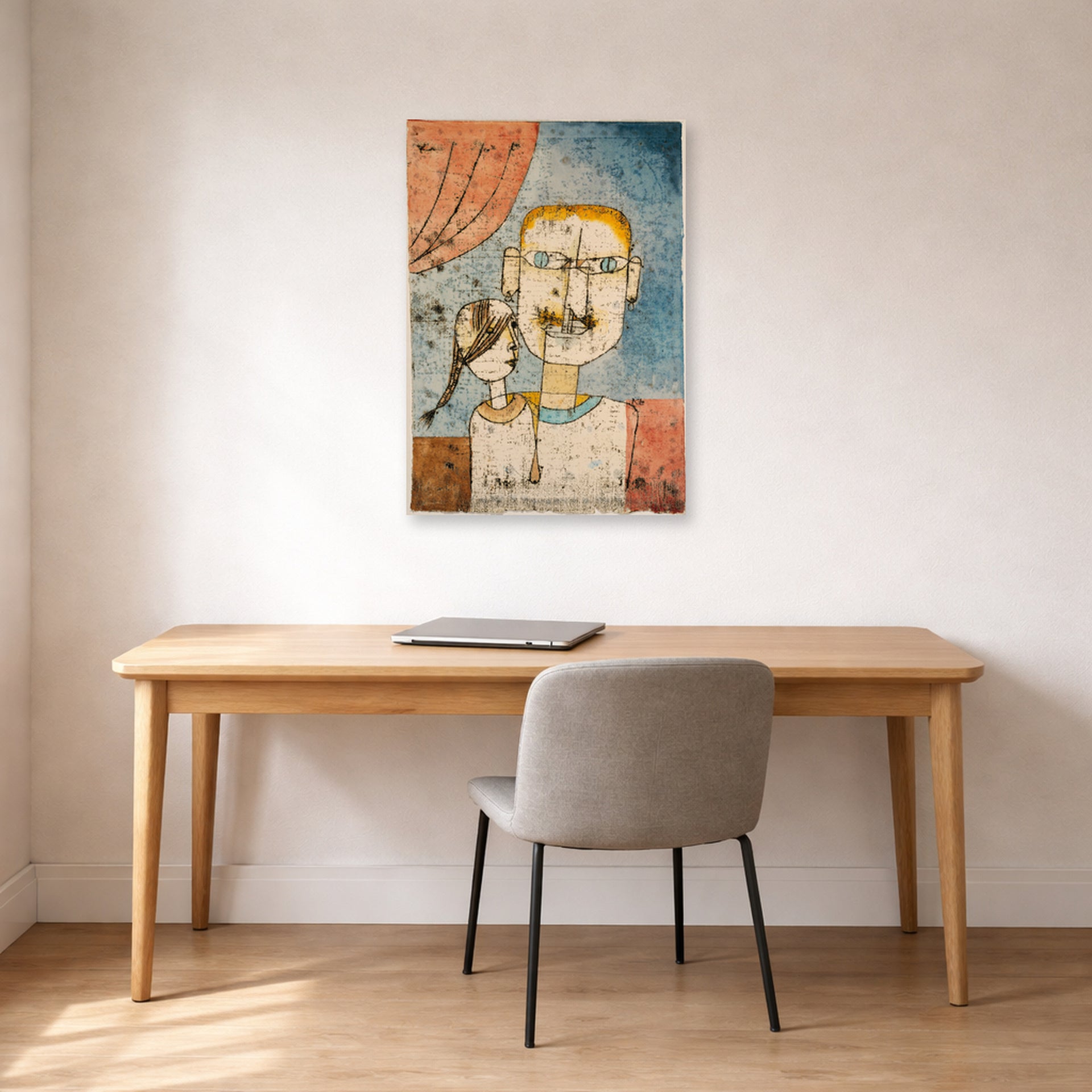 Unframed poster print of Paul Klee's Adam and Little Eve displayed on a wall in an office