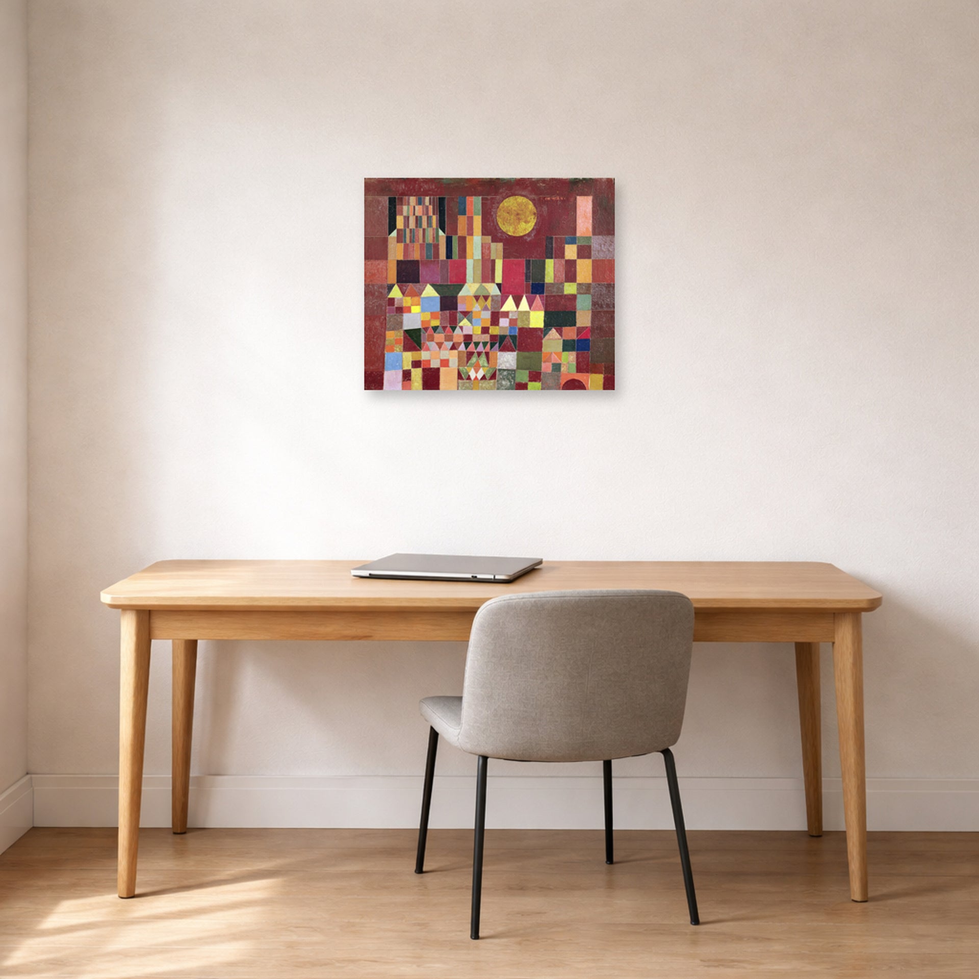 Unframed poster print of Paul Klee's Castle and Sun displayed on a wall in an office