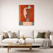 Unframed poster print of Paul Klee's Clown displayed on a wall in a living room