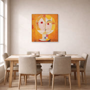 Gallery-wrapped canvas print of Paul Klee's Senecio displayed on a wall in a dining room