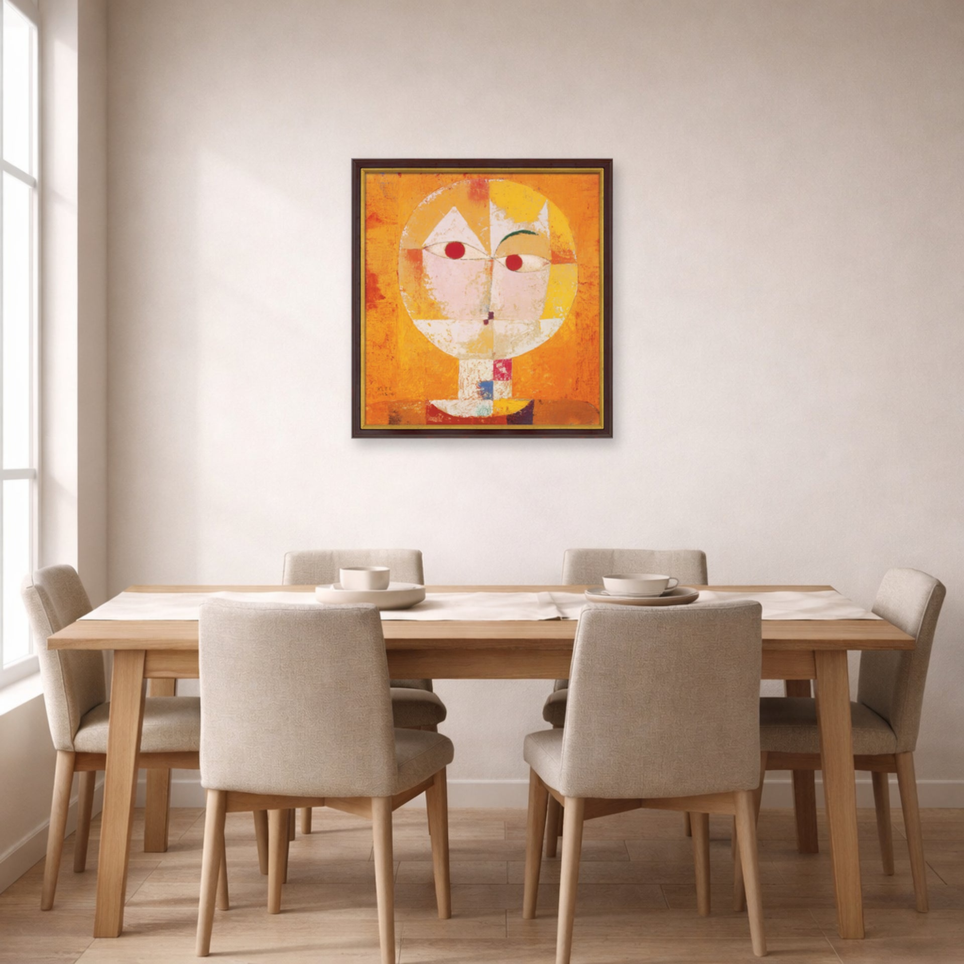 Unframed poster print of Paul Klee's Senecio displayed on a wall in a dining room