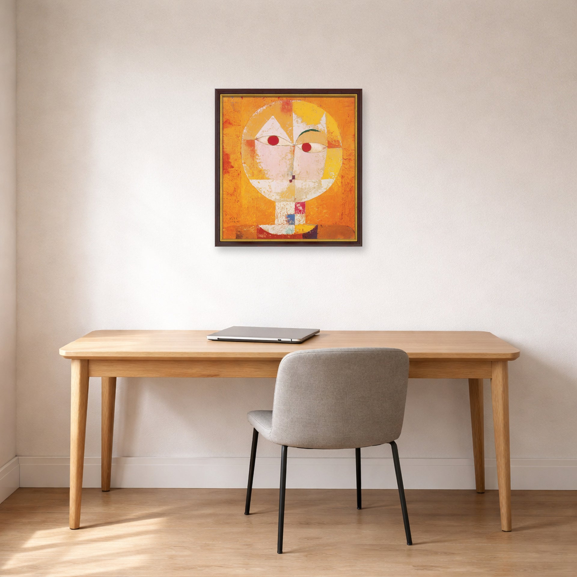 Unframed poster print of Paul Klee's Senecio displayed on a wall in an office