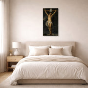 Unframed poster print of Peter Paul Rubens' 'Christ on the cross' displayed on a wall in a bedroom