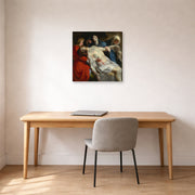 Unframed poster print of Peter Paul Rubens' 'Entombment' displayed on a wall in an office