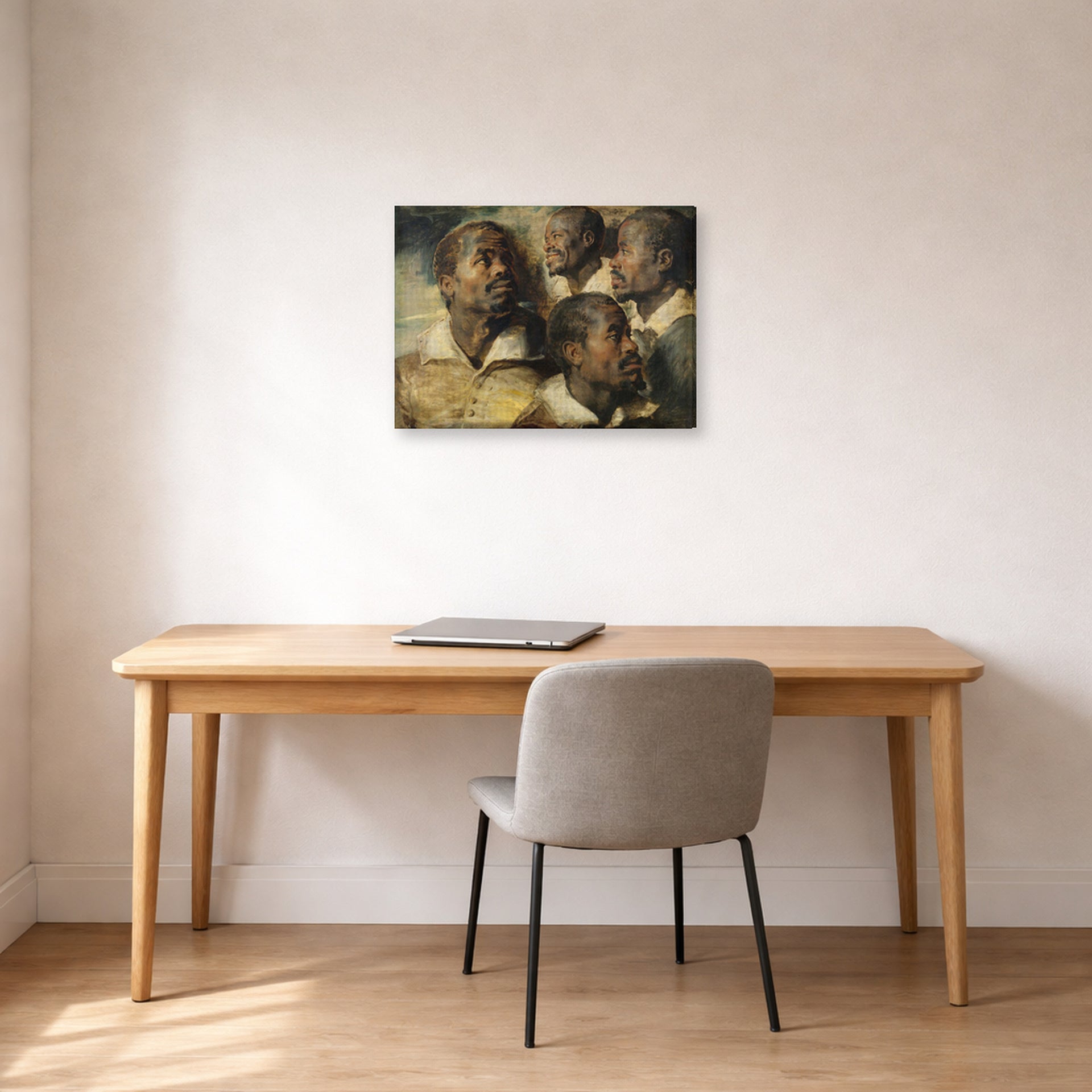 Gallery-wrapped canvas print of Peter Paul Rubens' 'Four Studies of the head of a Moore' displayed on a wall in an office