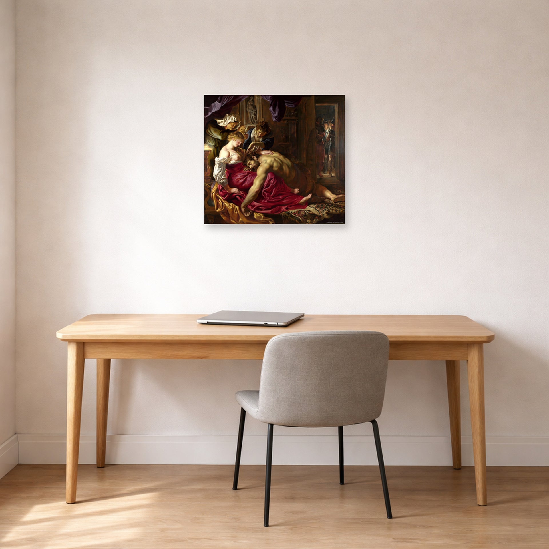 Unframed poster print of Peter Paul Rubens' 'Samson and Delilah' displayed on a wall in an office