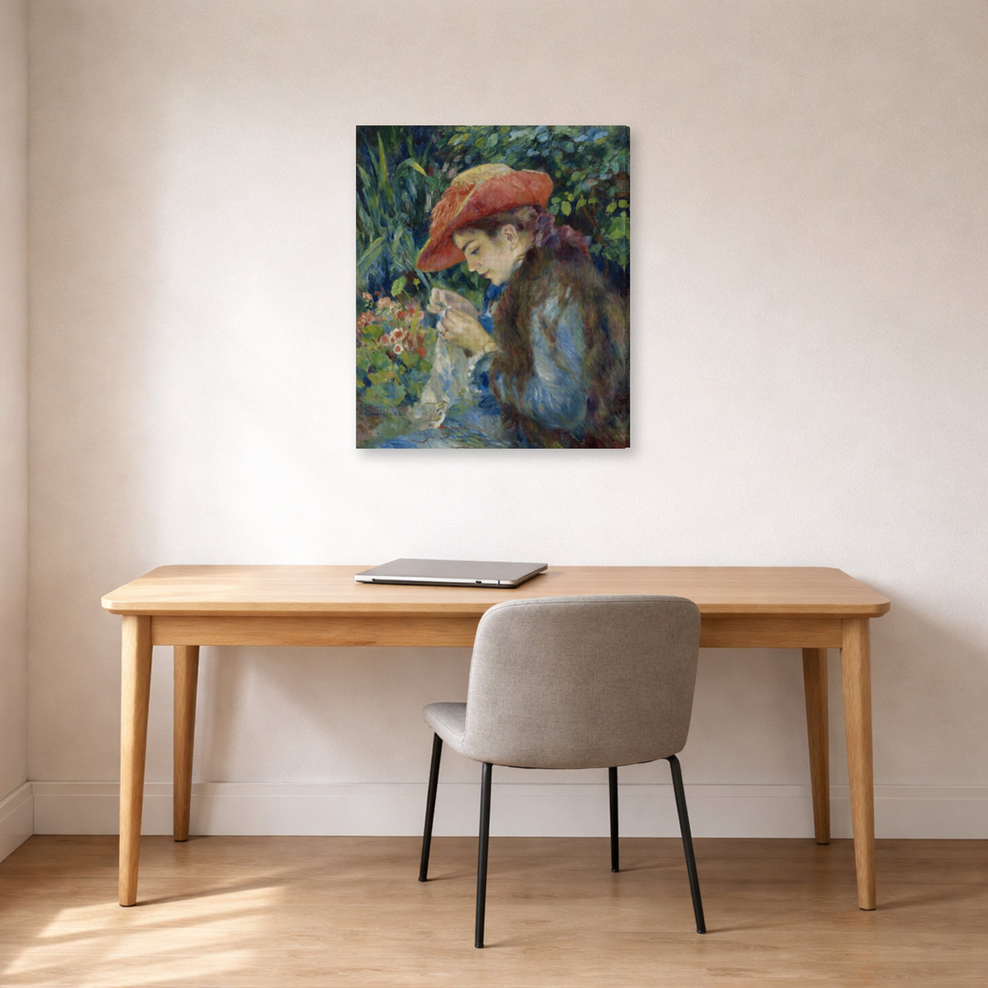 Gallery-wrapped canvas print of Pierre-Auguste Renoir's Marie Thérèse Durand Ruel Sewing displayed on a wall in an office