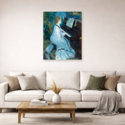 Unframed poster print of Pierre-Auguste Renoir's Woman at the Piano displayed on a wall in a living room