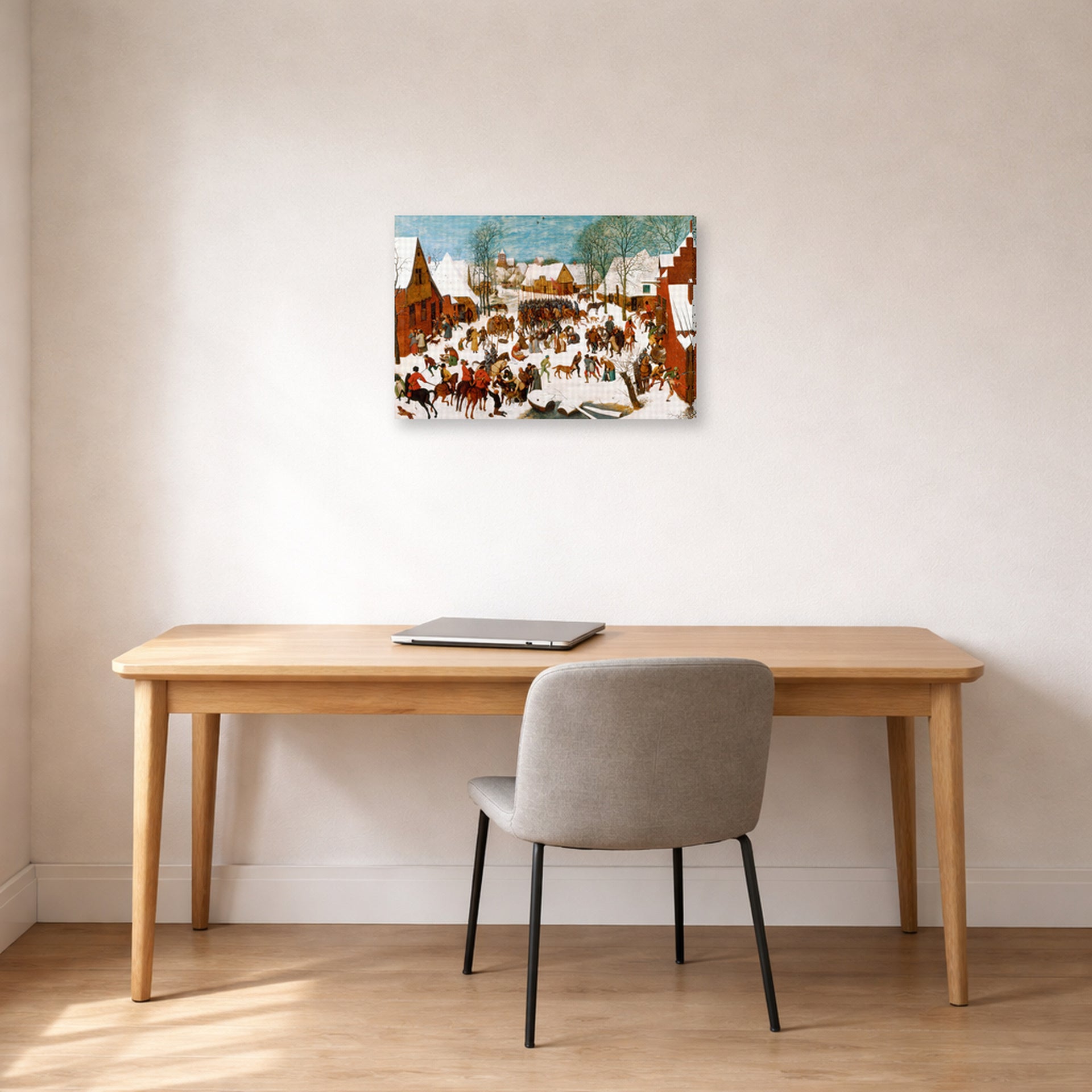 Gallery-wrapped canvas print of Pieter Bruegel the Elder's Massacre of the Innocents displayed on a wall in a home office