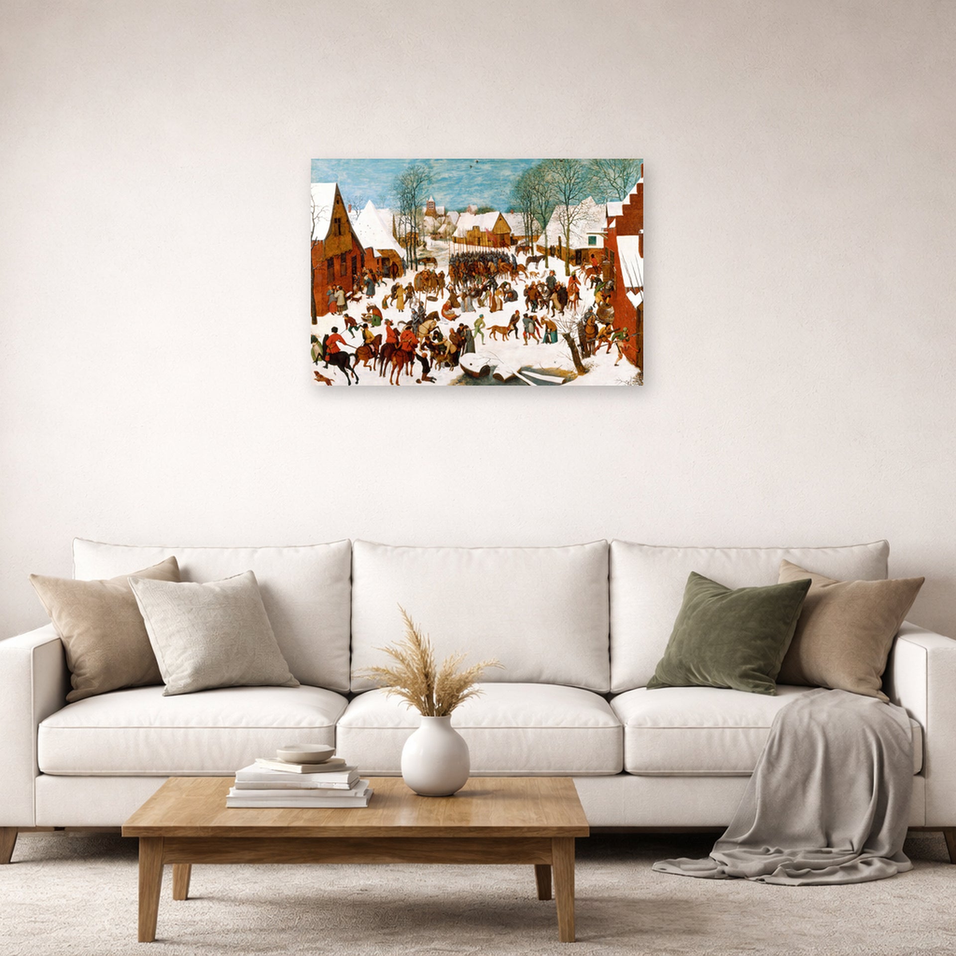 Unframed poster print of Pieter Bruegel the Elder's Massacre of the Innocents displayed on a wall in a living room
