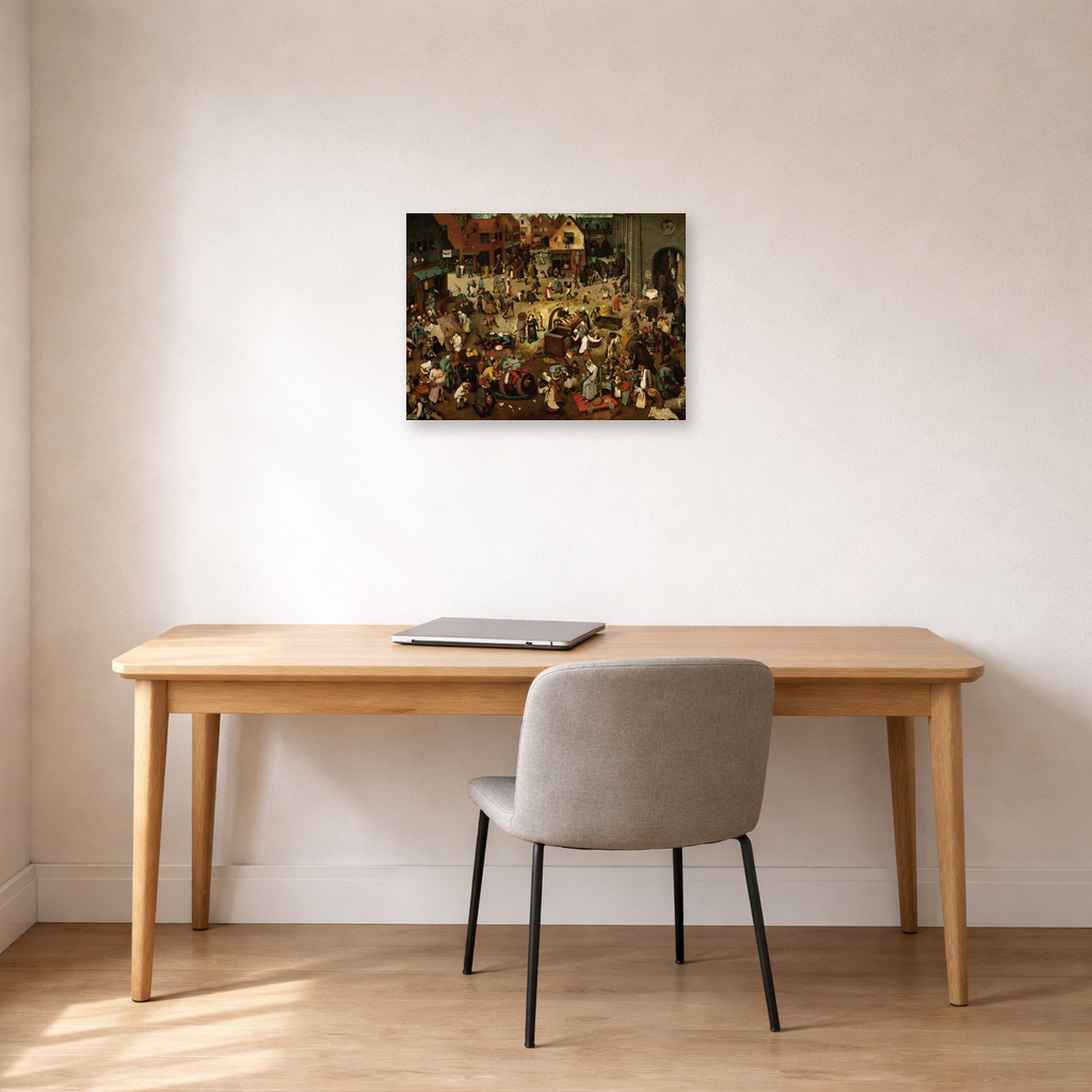 Unframed poster print of Pieter Bruegel the Elder's The Fight Between Carnival and Lent displayed on a wall in a home office