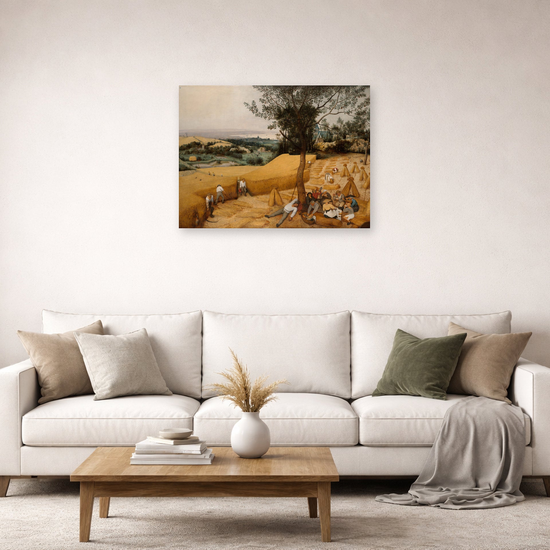 Unframed poster print of Pieter Bruegel the Elder's The Harvesters displayed on a wall in a living room
