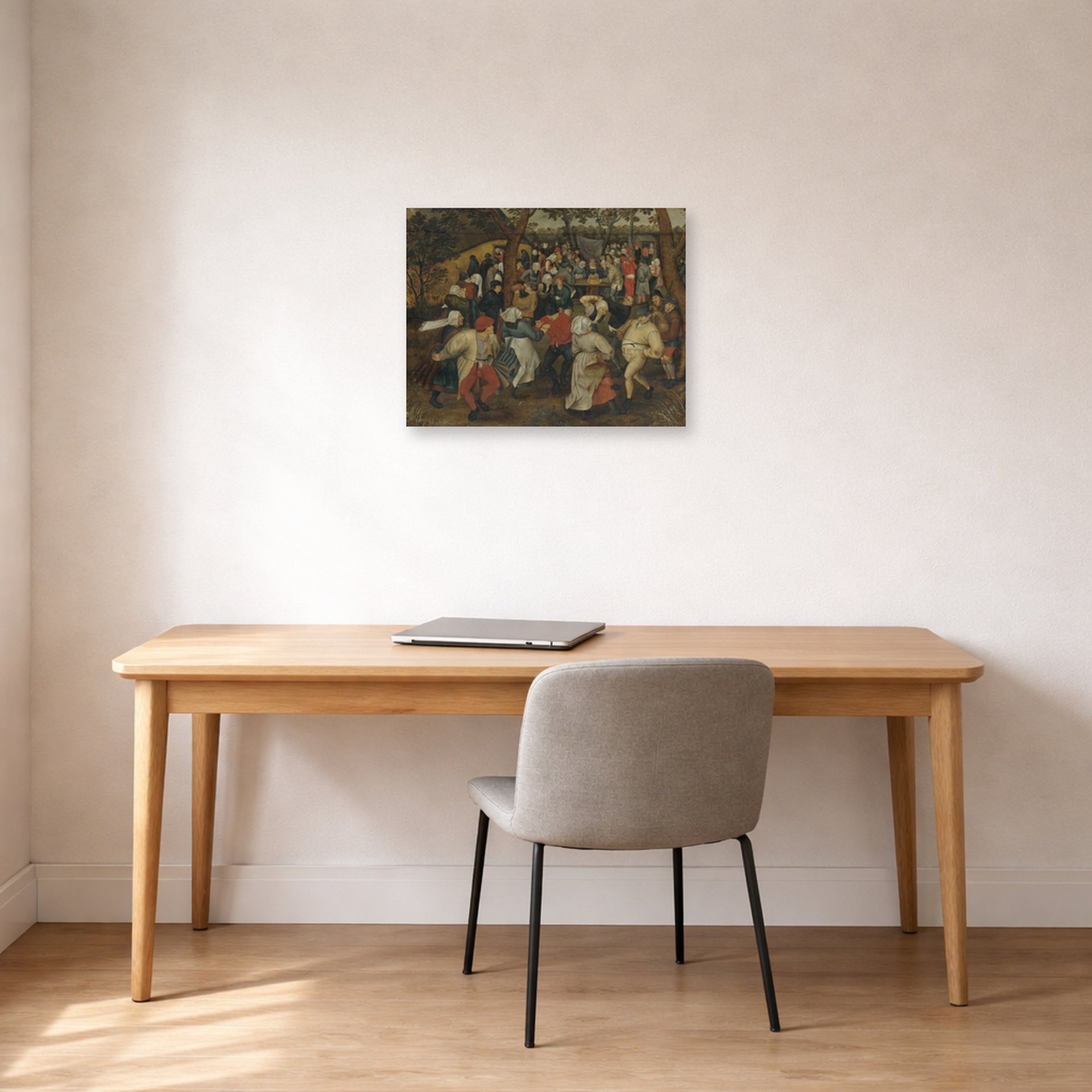 Unframed poster print of Pieter Bruegel the Elder's The Outdoor Wedding Feast displayed on a wall in a home office