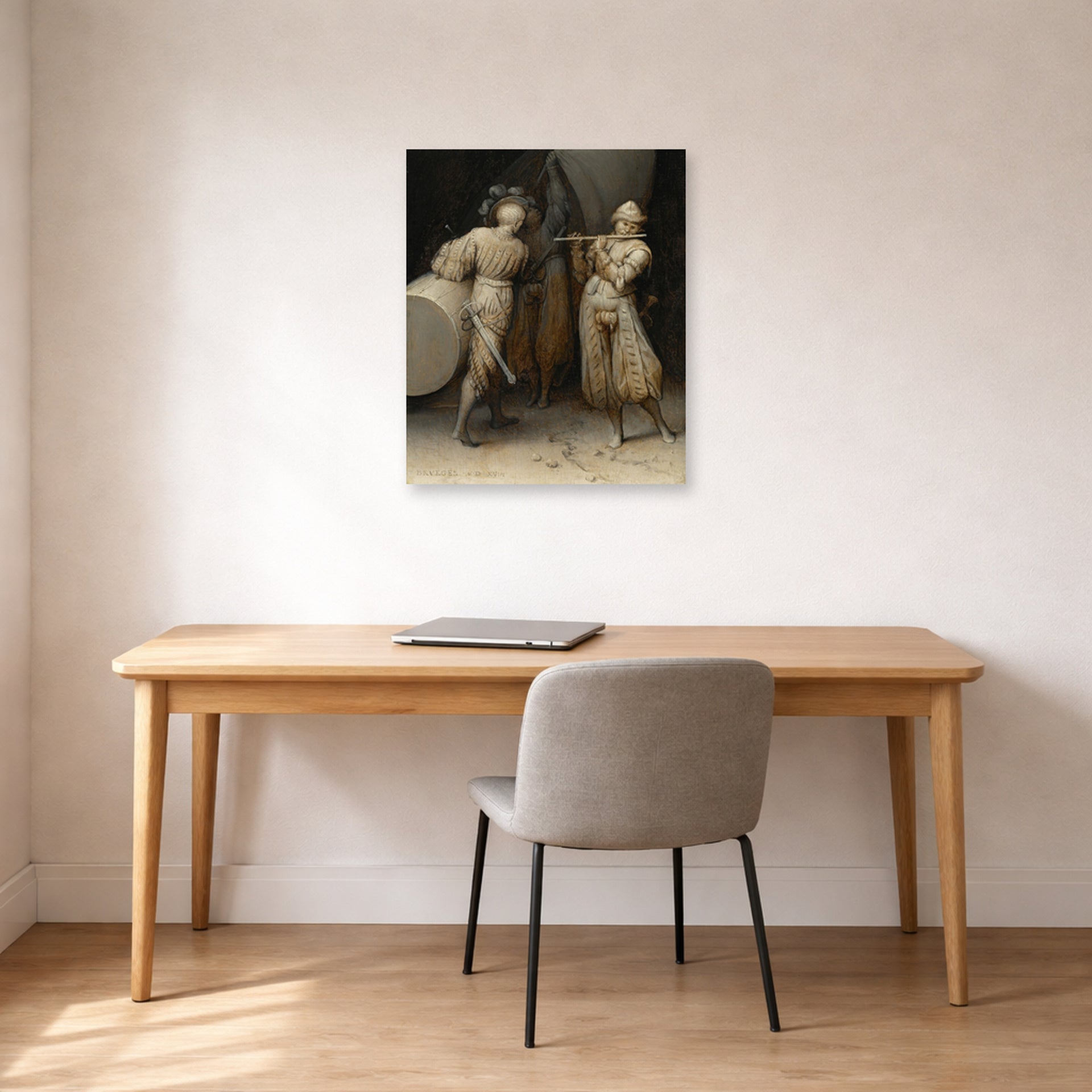 Unframed poster print of Pieter Bruegel the Elder's The Three Soldiers displayed on a wall in a home office