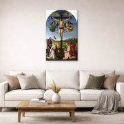 Gallery-wrapped canvas print of Raphael's Crucifixion with the Virgin, Saints and Angels displayed on a wall in a living room
