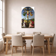 Unframed poster print of Raphael's Crucifixion with the Virgin, Saints and Angels displayed on a wall in a dining