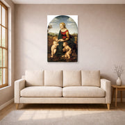Unframed poster print of Raphael's La belle jardinière displayed on a wall in a living room