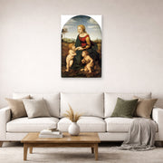 Unframed poster print of Raphael's La belle jardinière displayed on a wall in a living room