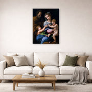 Unframed poster print of Raphael's Madonna of the Rose displayed on a wall in a living room
