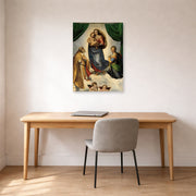 Unframed poster print of Raphael's Sistine Madonna displayed on a wall in a office