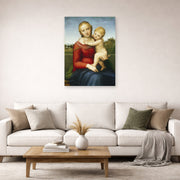 Unframed poster print of Raphael's Small Cowper Madonna displayed on a wall in a living room