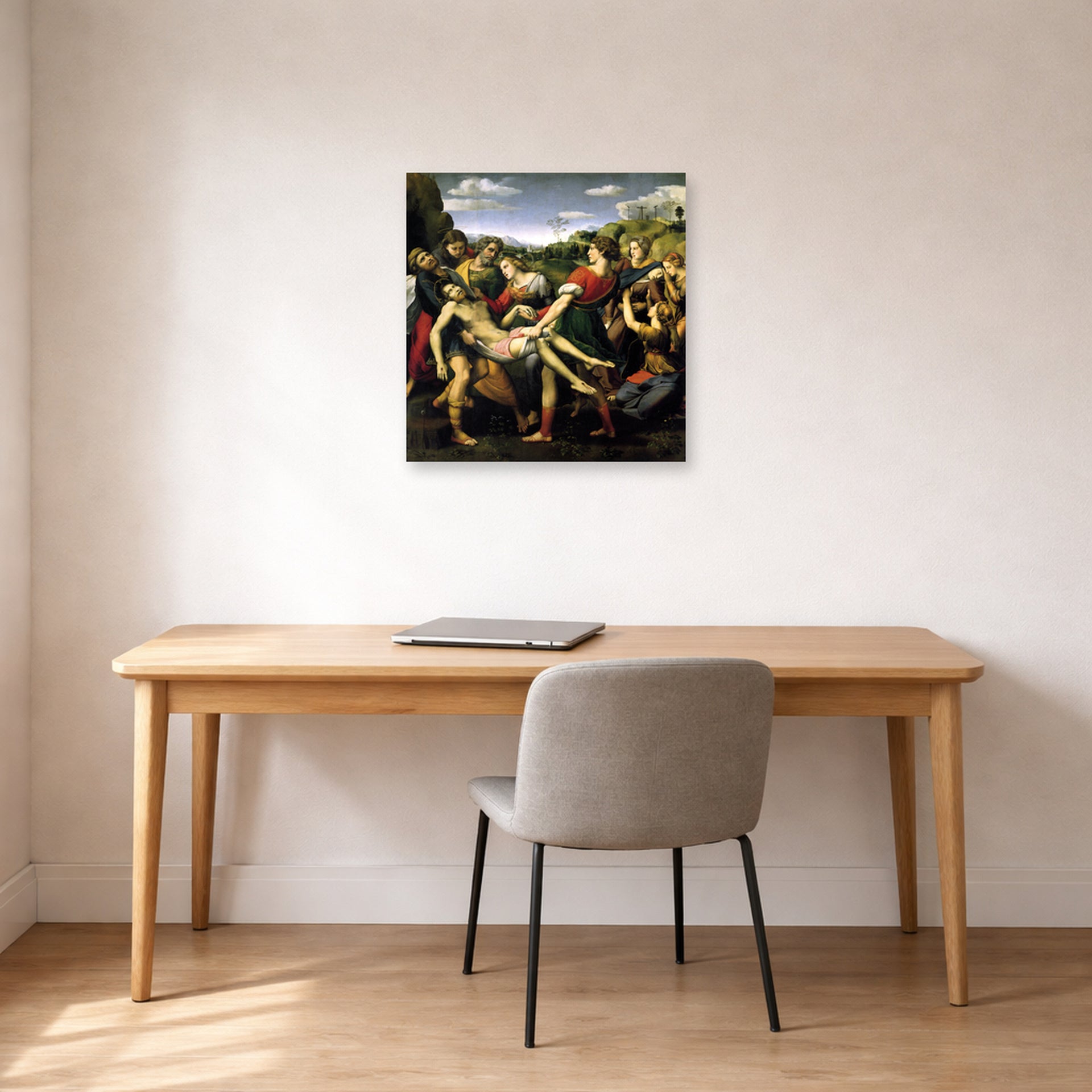 Unframed poster print of Raphael's The Deposition displayed on a wall in a office