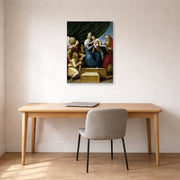 Unframed poster print of Raphael's The Holy Family with St. Raphael, Tobias and St. Jerome displayed on a wall in a office