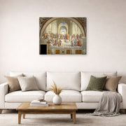 Gallery-wrapped canvas print of Raphael's The School of Athens displayed on a wall in a living room