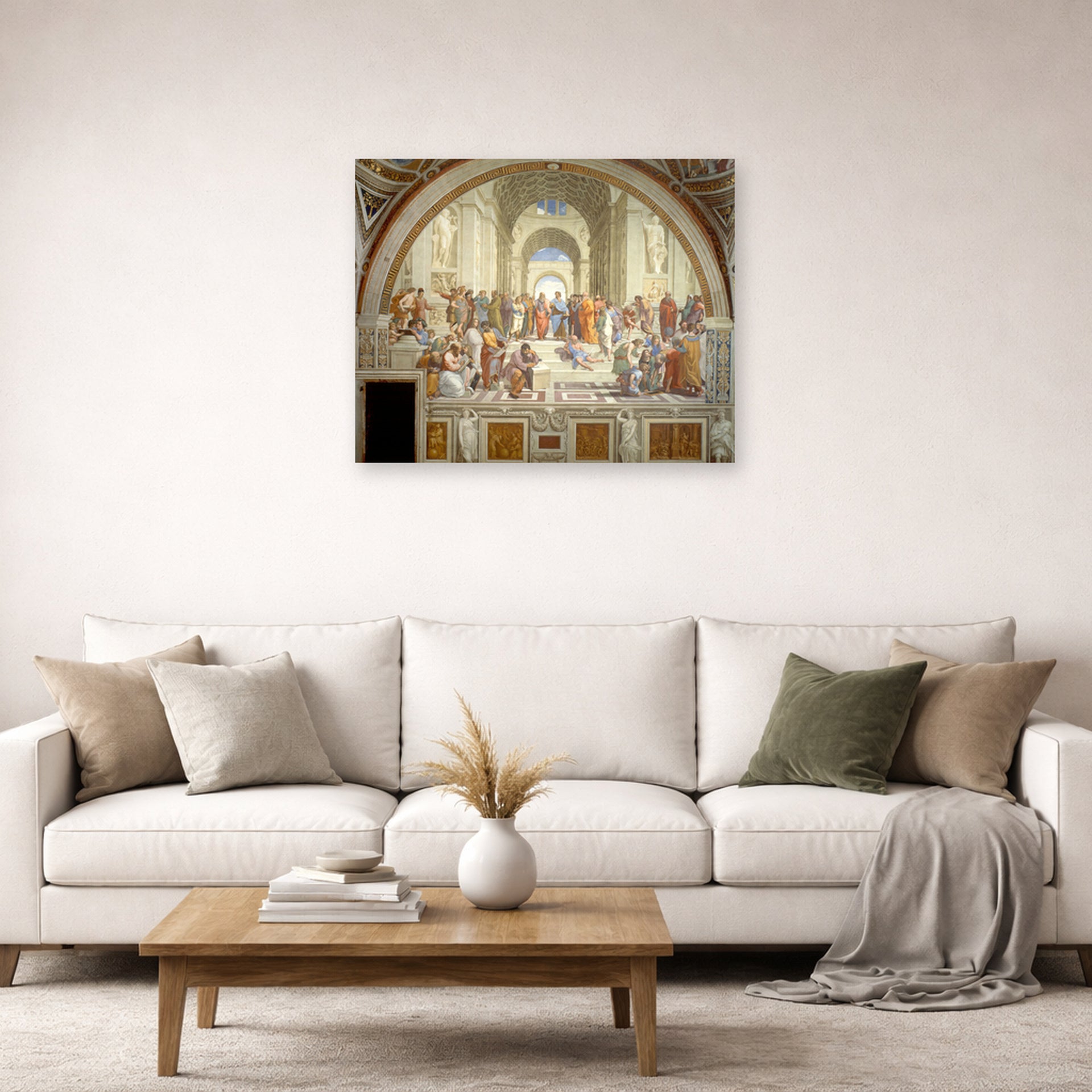 Unframed poster print of Raphael's The School of Athens displayed on a wall in a living room