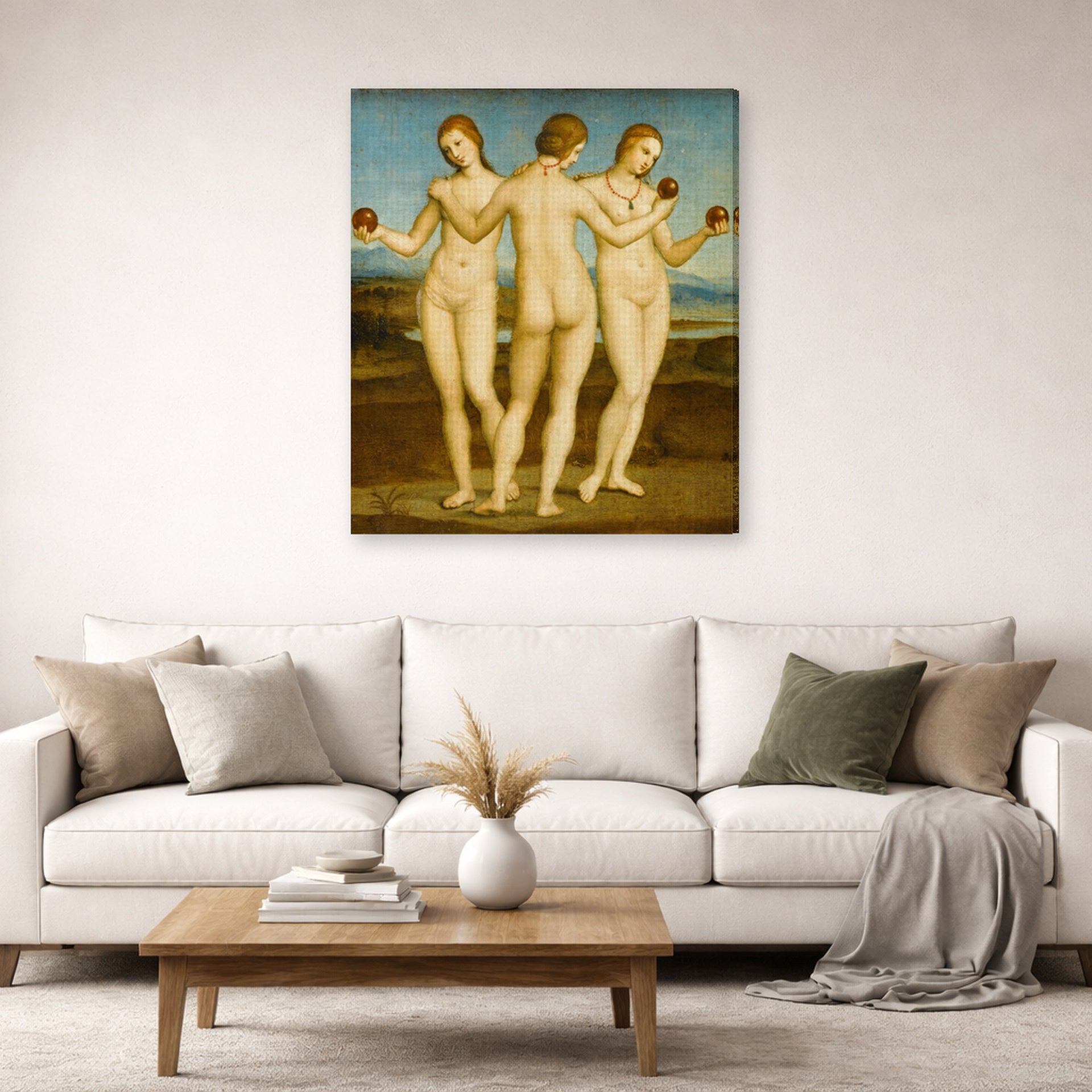 Gallery-wrapped canvas print of Raphael's Three Graces displayed on a wall in a living room