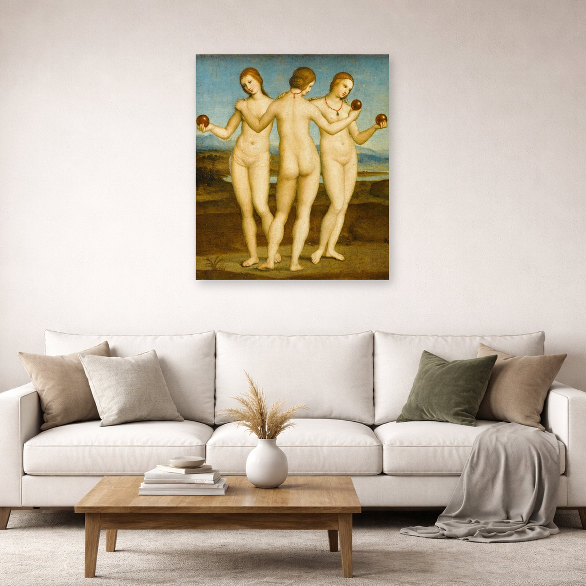 Unframed poster print of Raphael's Three Graces displayed on a wall in a living room