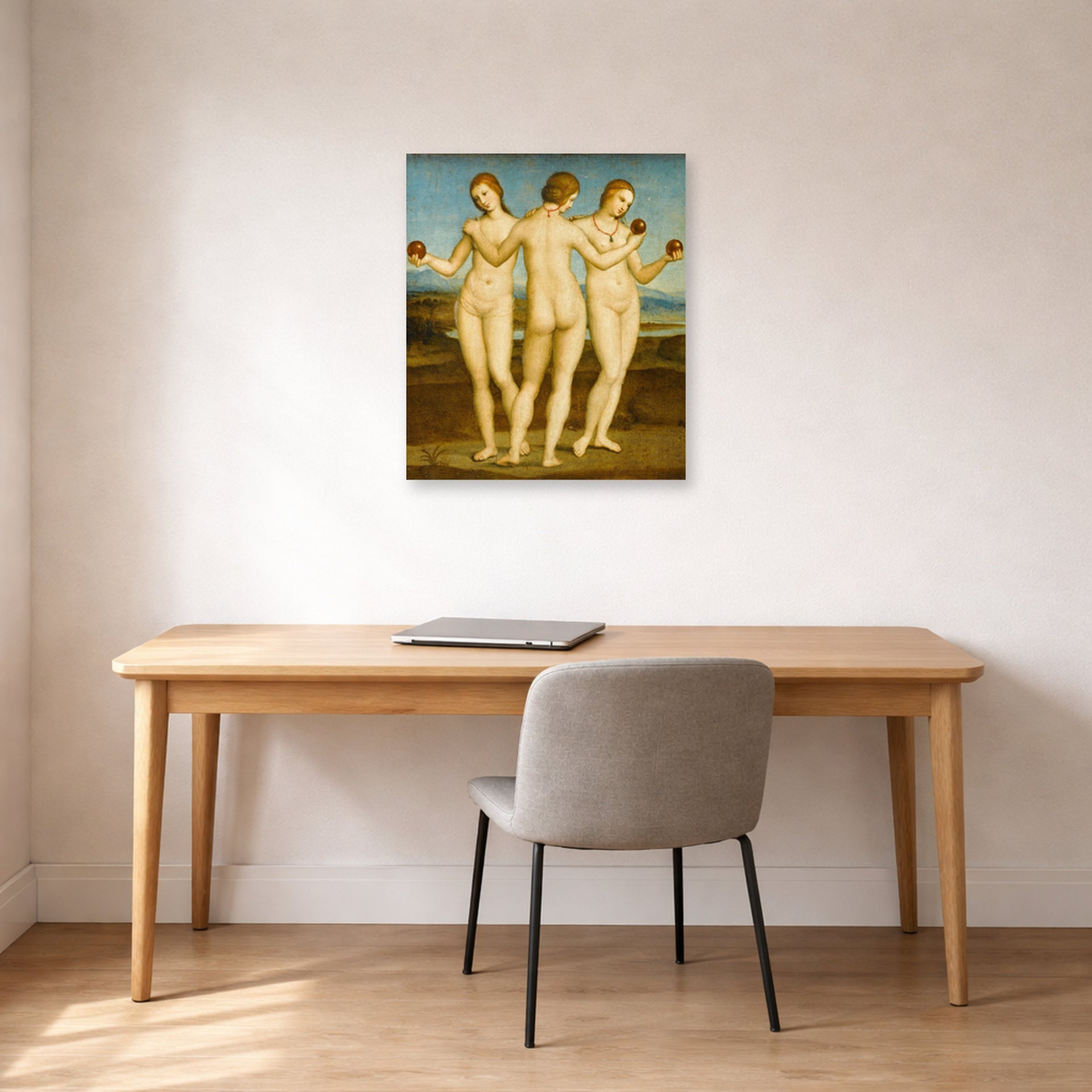Unframed poster print of Raphael's Three Graces displayed on a wall in a office