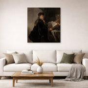 Gallery-wrapped canvas print of Rembrandt's A Scholar Seated at a Desk displayed on a wall in a living room