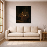 Gallery-wrapped canvas print of Rembrandt's A Scholar in His Study displayed on a wall in a living room