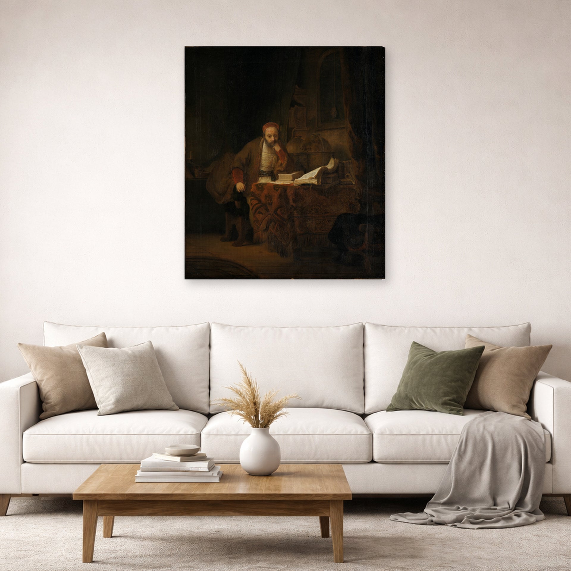 Gallery-wrapped canvas print of Rembrandt's A Scholar in His Study displayed on a wall in a living room