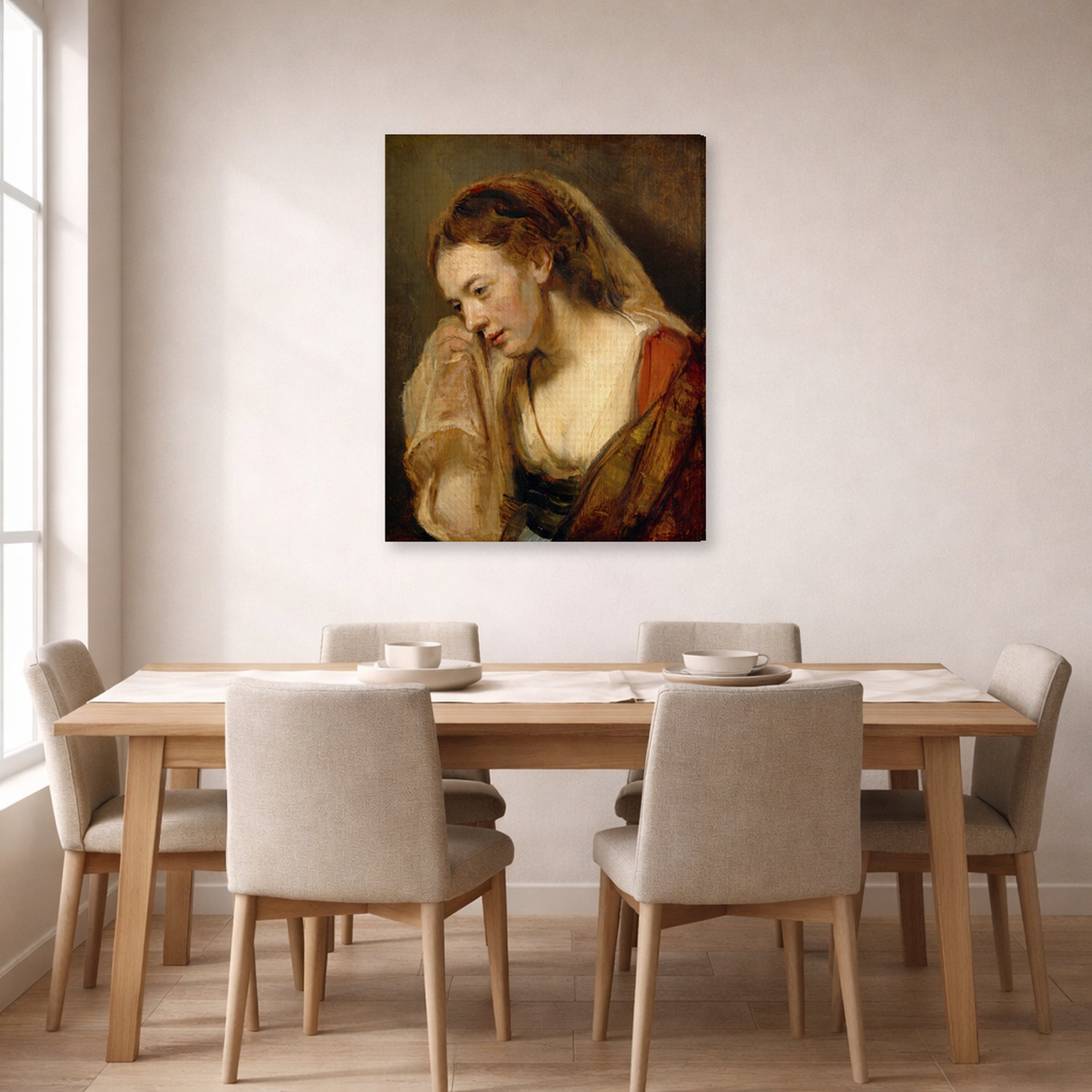 Gallery-wrapped canvas print of Rembrandt's A Weeping Woman displayed on a wall in a dining room
