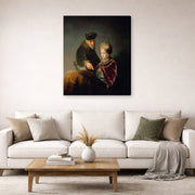 Gallery-wrapped canvas print of Rembrandt's A Young Scholar and His Tutor displayed on a wall in a living room