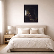 Gallery-wrapped canvas print of Rembrandt's Anna and the Blind Tobit displayed on a wall in a bedroom