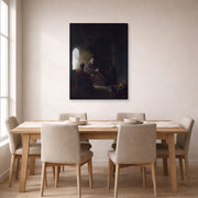 Gallery-wrapped canvas print of Rembrandt's Anna and the Blind Tobit displayed on a wall in a dining room