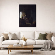 Gallery-wrapped canvas print of Rembrandt's Anna and the Blind Tobit displayed on a wall in a living room