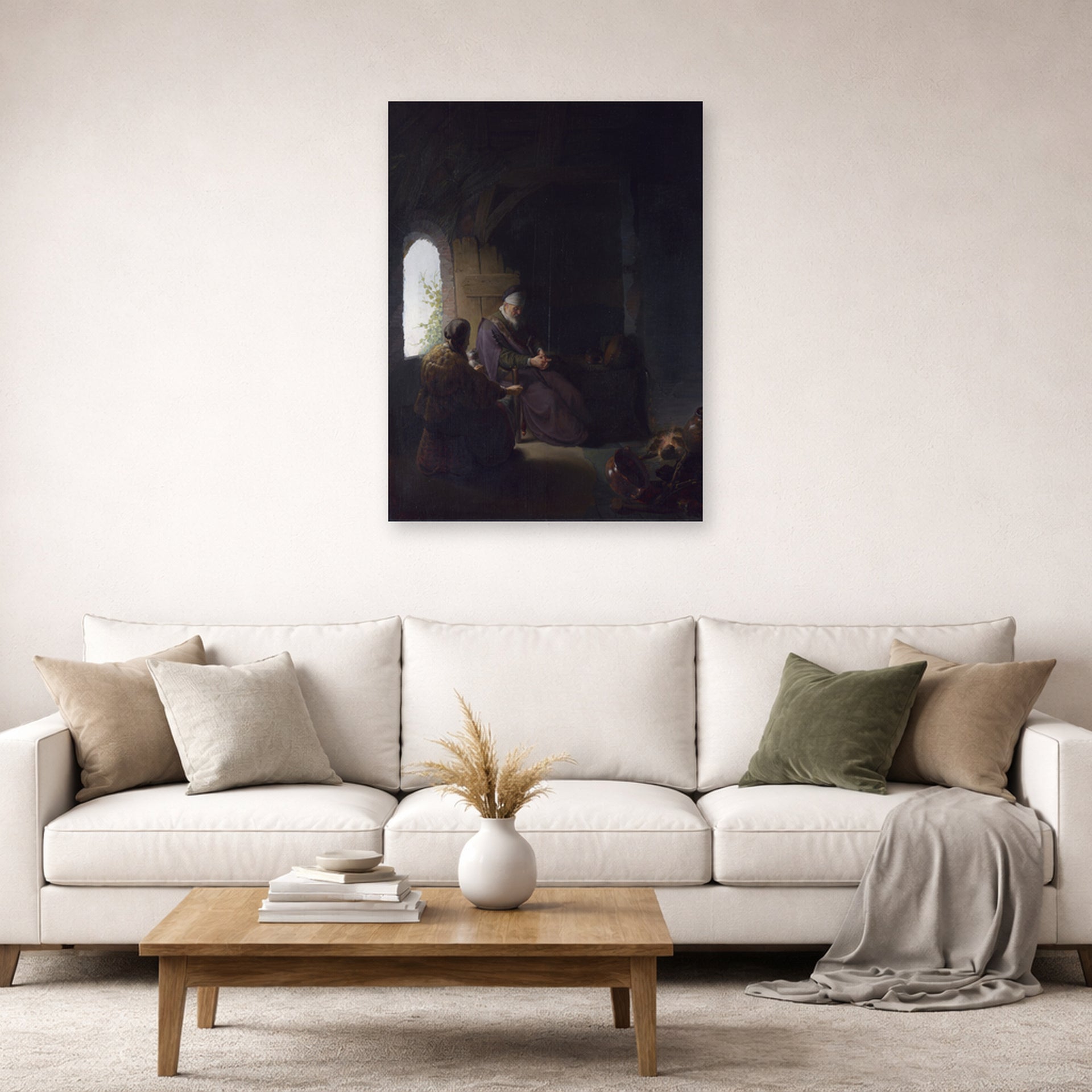 Unframed poster print of Rembrandt's Anna and the Blind Tobit displayed on a wall in a living room