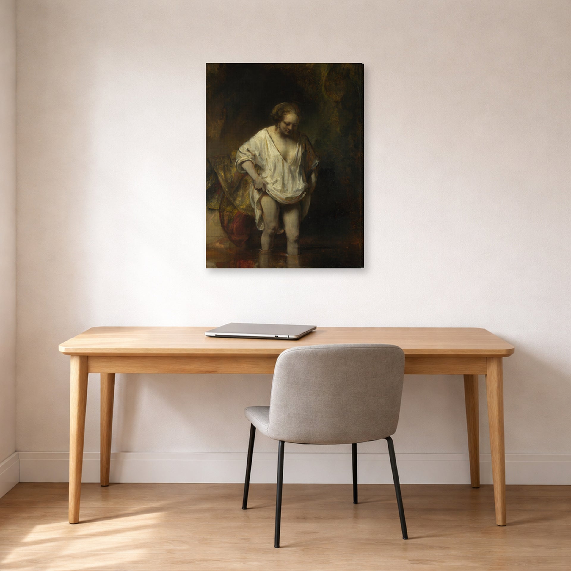 Gallery-wrapped canvas print of Rembrandt's Bathing Girl displayed on a wall in an office